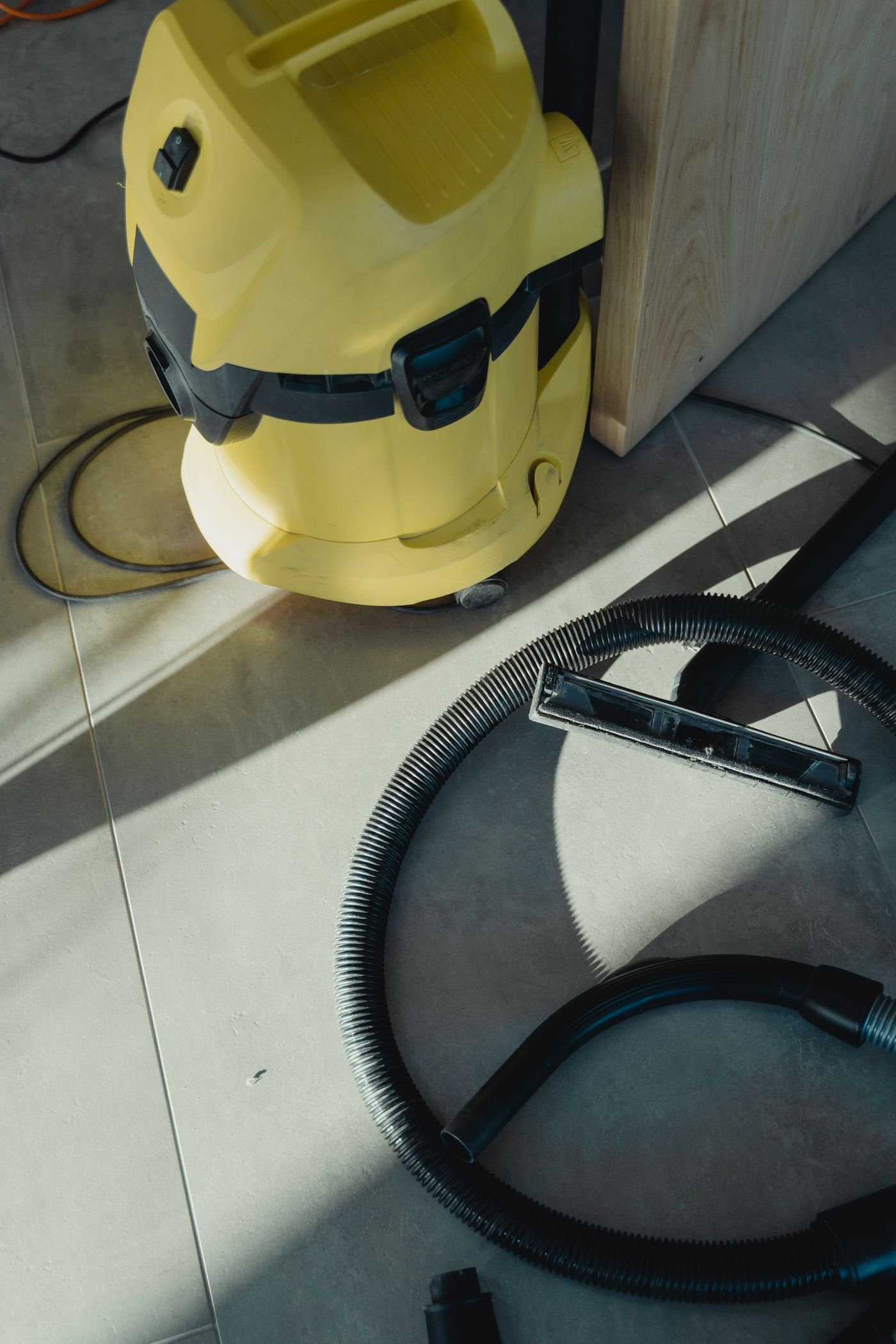 Professional vacuum equipment on a tiled floor